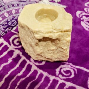 Natural Stone Candle Holder, has colors of light shimmering sand stone.