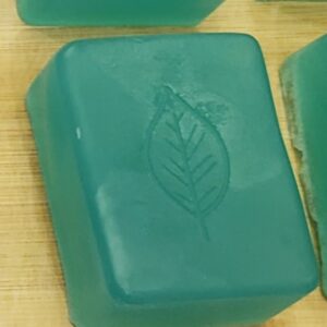 Homemade Soap, opaque emerald green bar with simple leaf